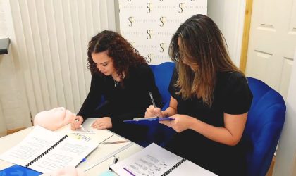 Two woman at Sf Aesthetics undertaking an advanced aesthetics course in Northampton